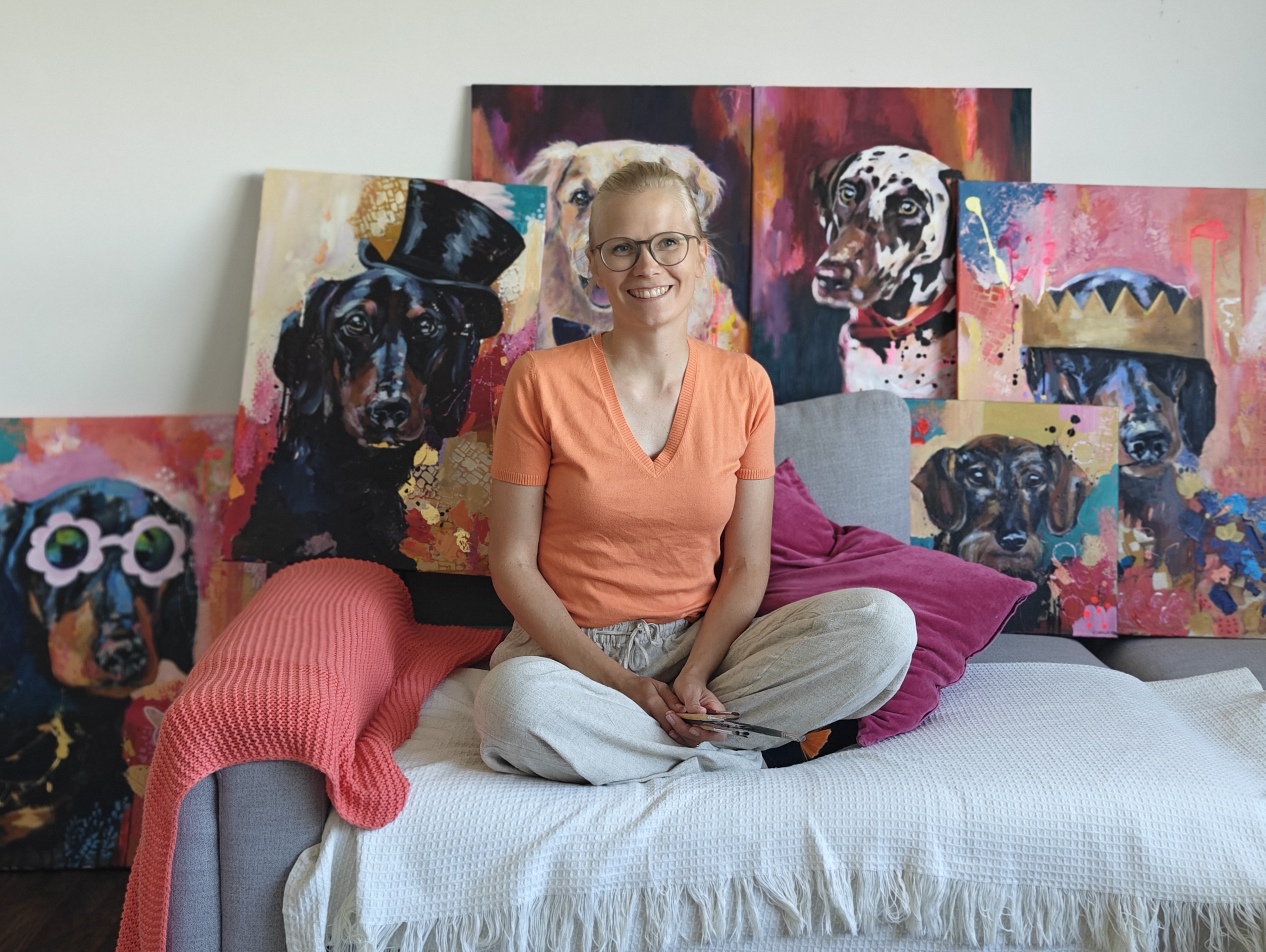 Emma-Sofia outdoors with dog paintings