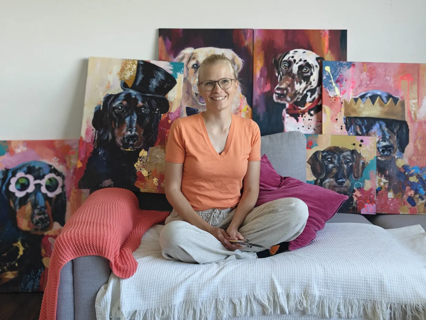 Emma-Sofia outdoors with dog paintings